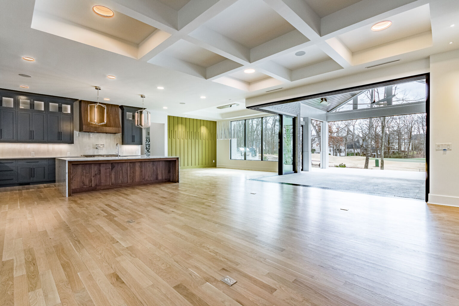 Open plan kitchen and family room in the Pond Bluff custom home