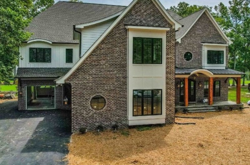Brick craftsman custom home on the Preston golf course in Cary
